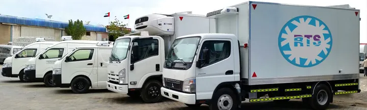 Refrigerated trucks and vans built by Refrigerated Transport Systems, parked outside the RTS factory in the UAE